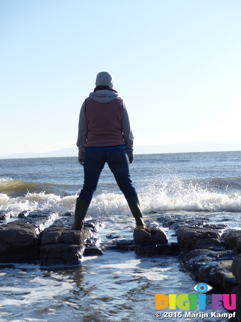 FZ011813 Jenni playing with waves on Llantwit Major beach